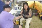 AOK-powwow-tatoo-Certified-Tattooist-&-Body-Piercer-Anishinaabe-Kwe-Social-Worker-Social-Justice-Advocate-Art-based-Peer-Engagement-Facilitator-the-one-and-only-Crystal-Kimewon-works-on-Mason