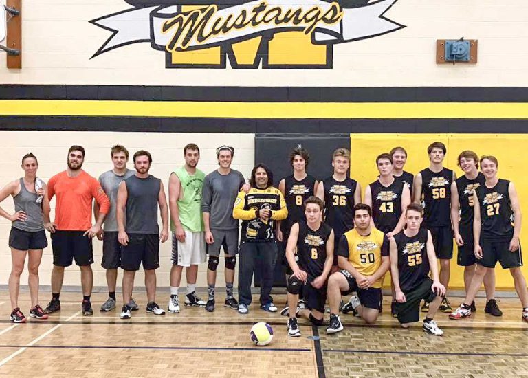 Alumni volleyball game sees vets take it
