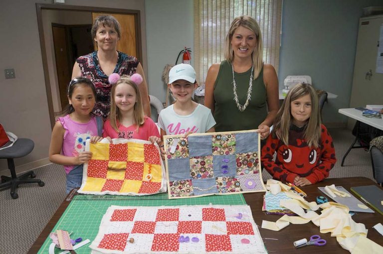 Assiginack summer camp sews fidget quilts for Alzheimer’s Society