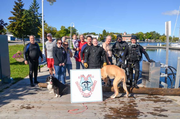 Dolphin Aquatic Diving Club clears debris from Little Current waterfront