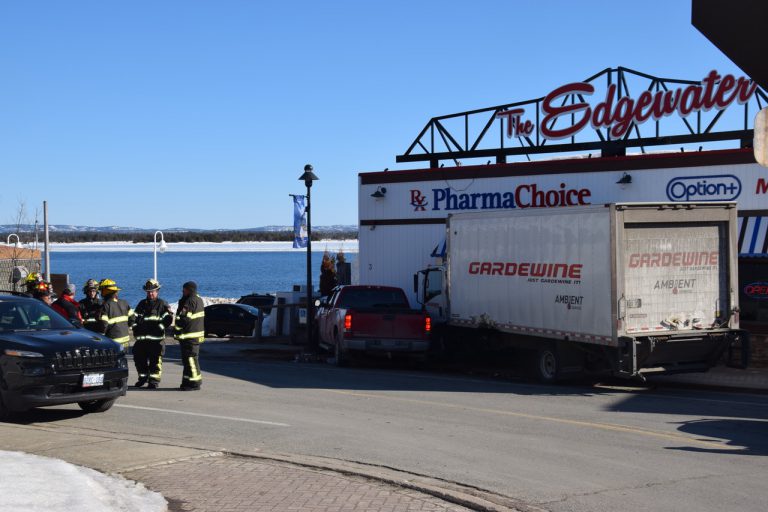 Vehicle strikes downtown pharmacy