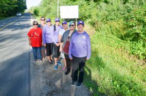 Members of the Wikwemikong FASD team join artist Kira Dowdall in front of the new FASD billboard. In photo, from right, are Judy Black, Ms. Dowdall, Anna Kaboni, Shanna Peltier and members of the FASD team and Ms. Dowdall’s mother. photos by Michael Erskine