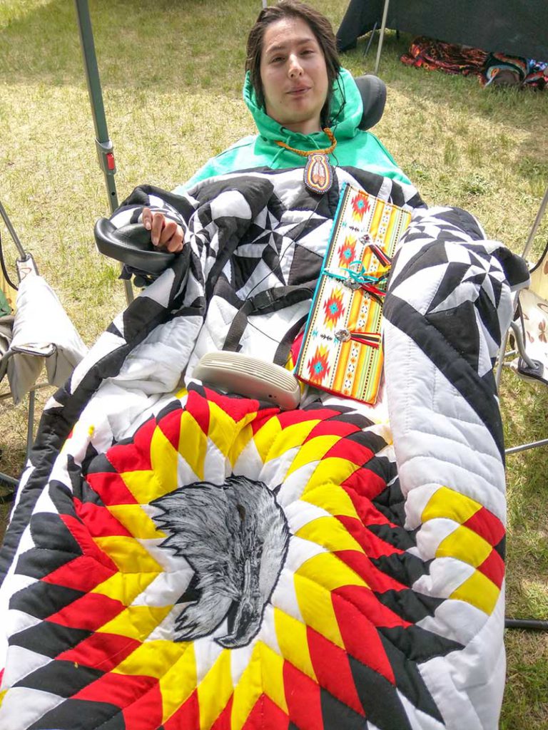 Eagle feather presented by community to a very brave young man