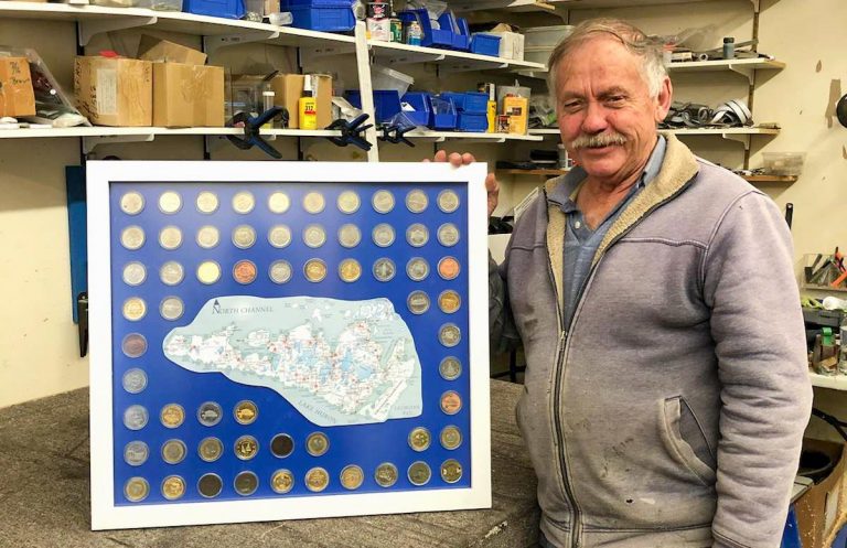 Avid Haweater coin collector Buck Belanger displays his full set of Haweater coins