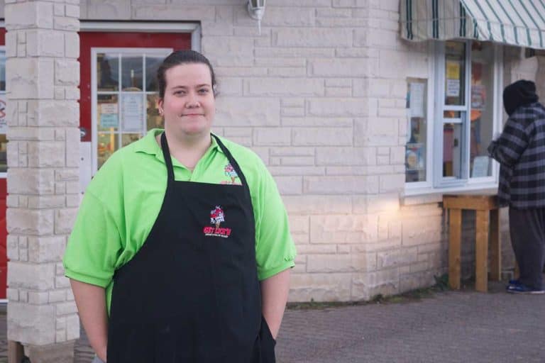 Marissa Peterson goes between her three cats and Three Cows