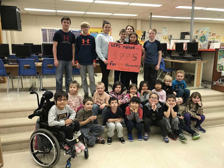 Little Current Public School students present funds to Texas