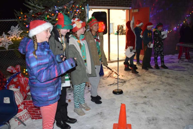Community gathers for outdoor Singalong Christmas gathering