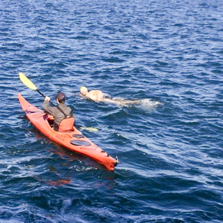 Crossing for a Cause athlete swims Lake Manitou