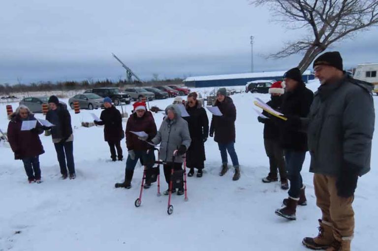 Island Singers and community members hold carolling event for Mary Buie