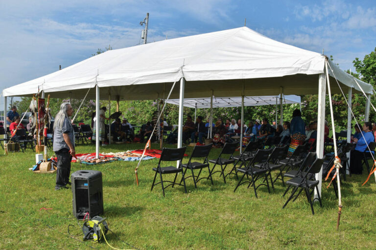 Pipe carriers and elders gather above Manitowaning Bay to honour pipes