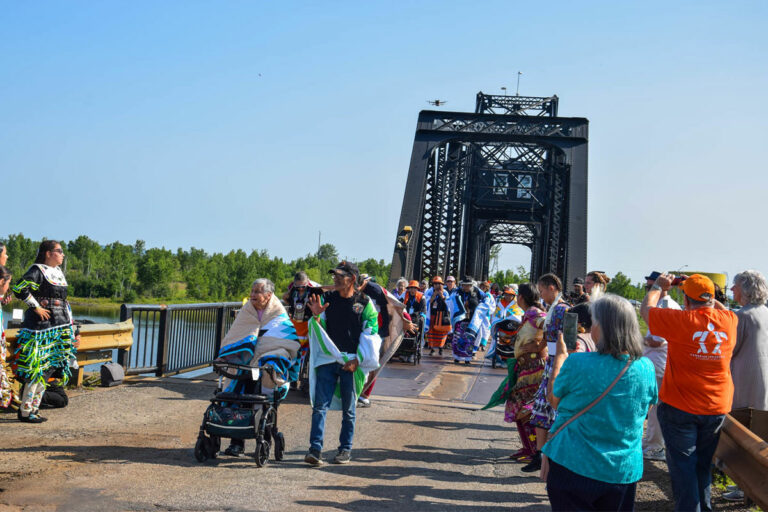 Residential school warriors make symbolic journey across the swing bridge