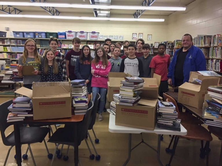 Island businessman donates over 3,000 books to C.C. McLean Public School