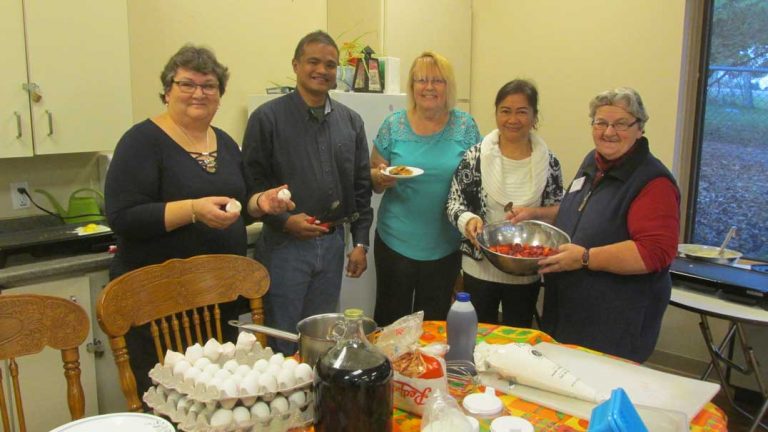 Volunteers, staff serve nursing home ladies with special breakfast