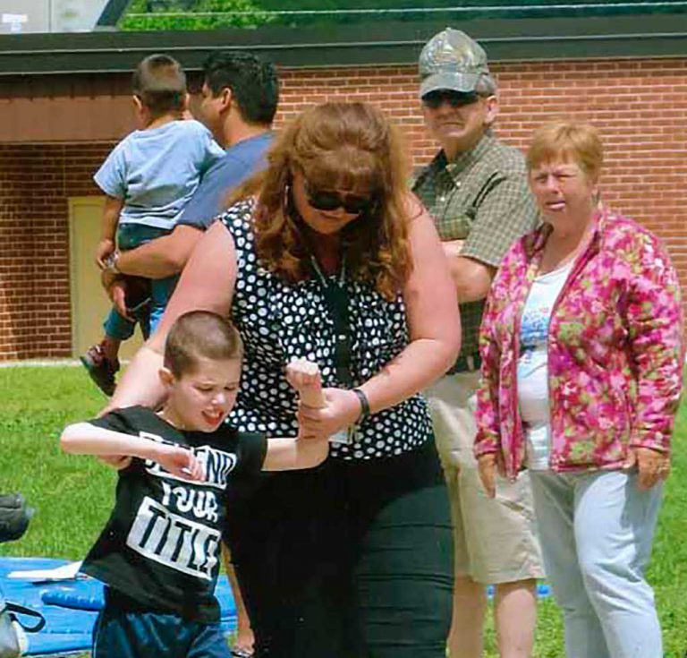 Student serves as inspiration  at primary track and field meet