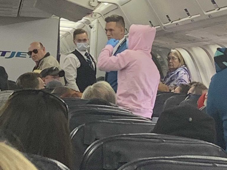 Island couple on plane with coronavirus hoaxer as vacation flight turned back