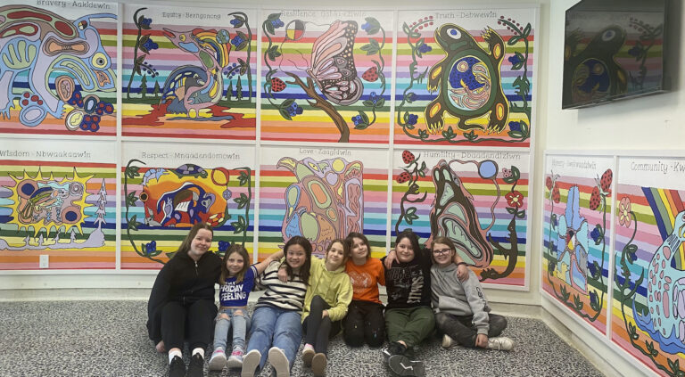 Michael Cywink paints Indigenous mural with A.B. Ellis students