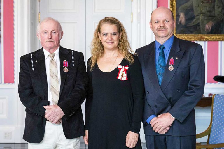 Two West End men presented with medals of bravery