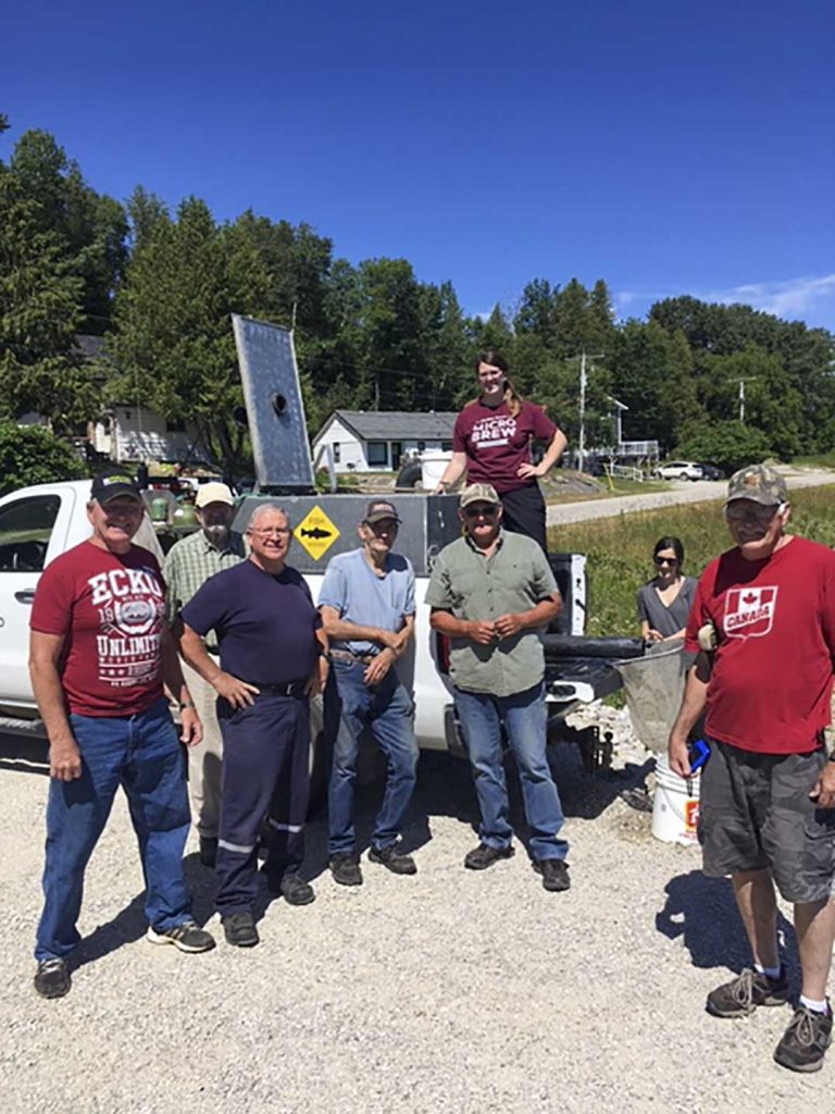 Gore Bay Fish and Game Club receives summer pond fingerling walleye from Blue Jay Creek