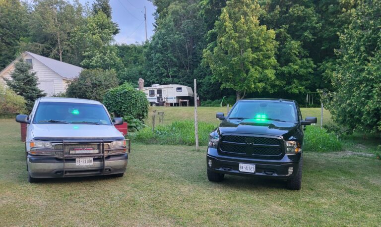 See a green flashing light in your mirror? Please pull over!