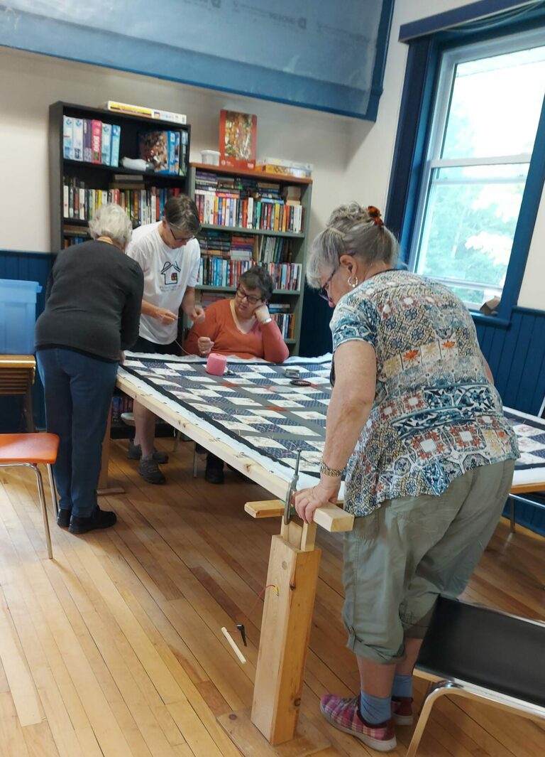 Kits and Quilts team helps care for individuals around the world