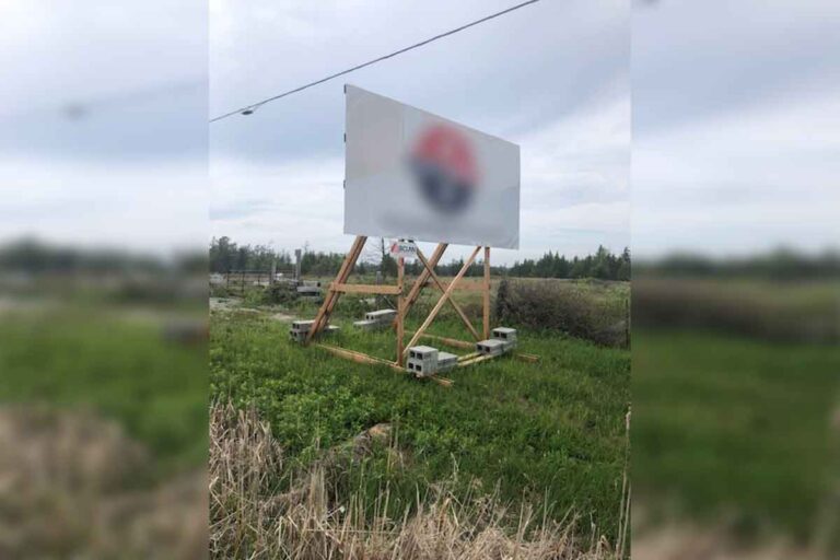 Billboard blocking access to Lewis Lake will soon be moved