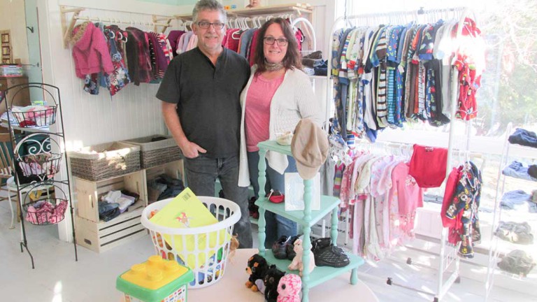 Budget-minded couple helping families save money