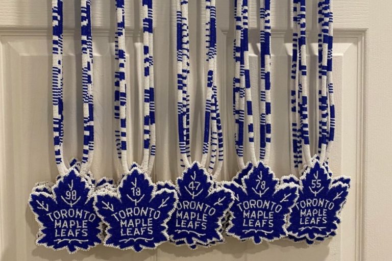 Wiikwemkoong women gift Toronto Maple Leafs with beaded medallions