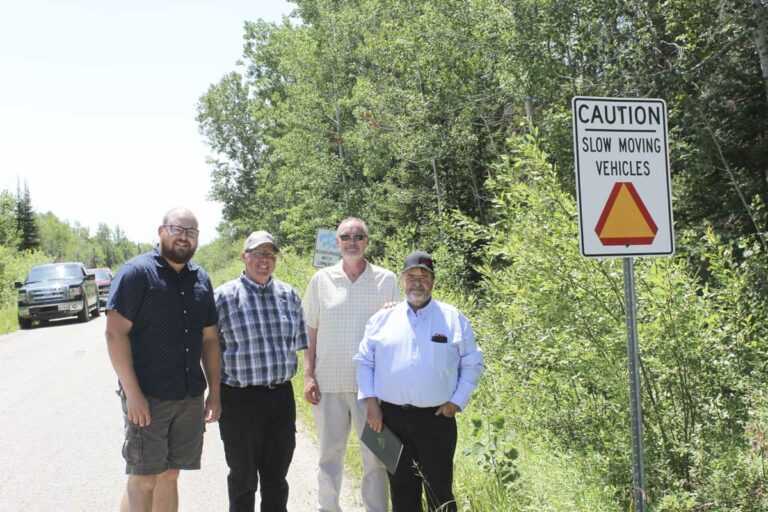Members of the Manitoulin-North Shore Federation of Agriculture (FOA) stand beside the first ‘slow moving vehicle’ sign promoting awareness to members of the public. In photo, from left, is Billings councillor Dave Hillyard, and MNSFOA members Mike Johnston, Ian Nokes and Bill Orford.