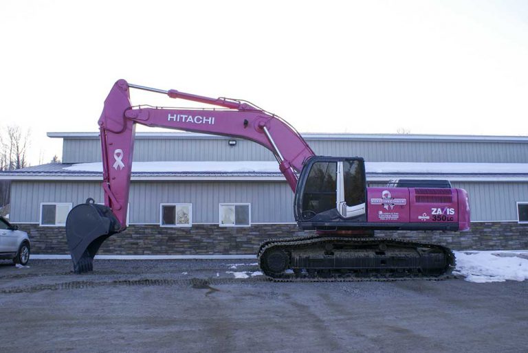 Corbiere brothers paint excavator pink, honour family members claimed by cancer