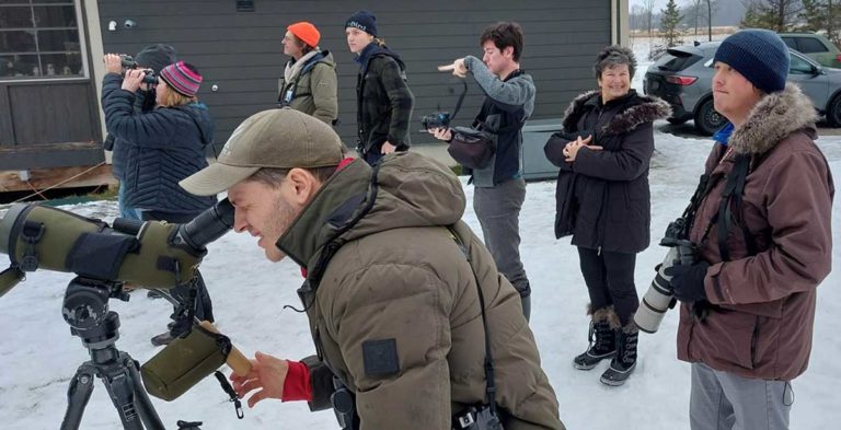 people outdoors taking photos