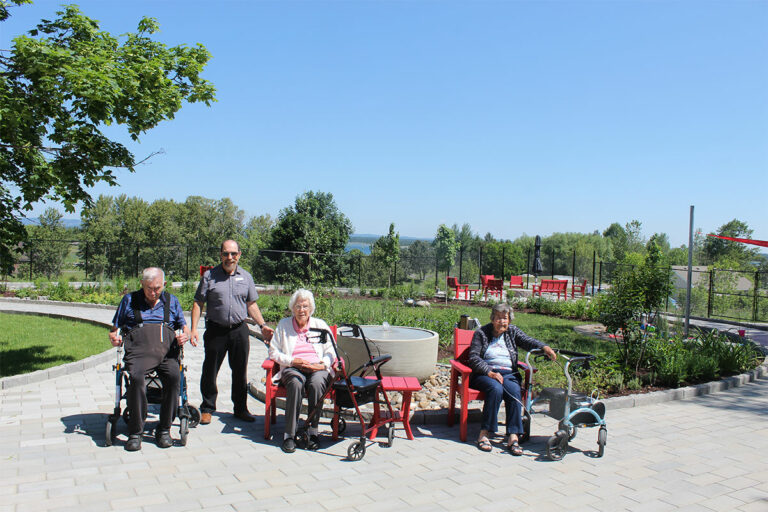 Centennial Manor celebrates courtyard, gathering place opening
